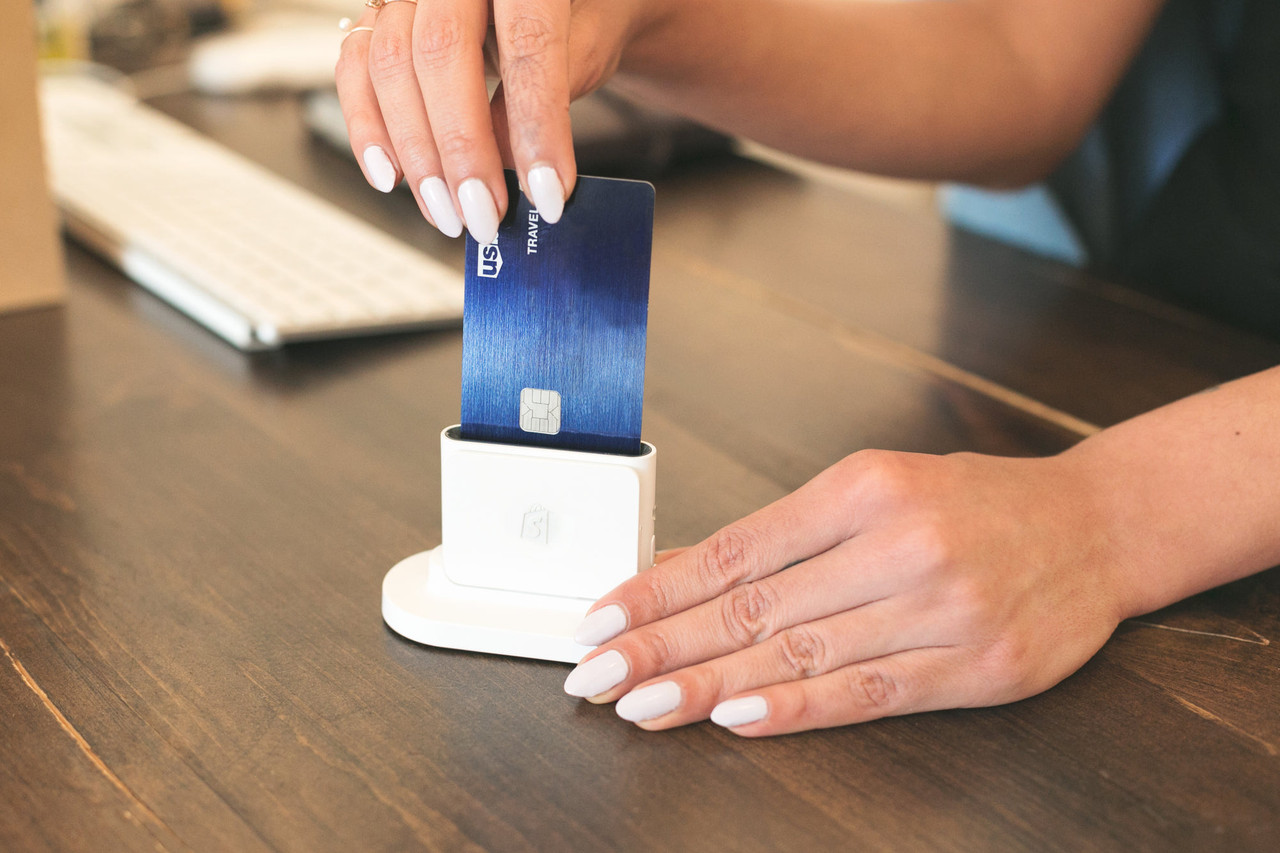 A contactless card being tapped on a card reader