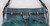 DKNY Metallic Blue Leather Handbag with Blue Grey Feathers Gold Tone Fittings