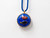 Scrives Lapis Lazuli Double Side Fish Mina Kari Enamel 23 Karat Gold Pendant