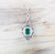 Emerald with Diamond Pendant Set in 18 Karat White Gold Settings