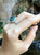 Blue Sapphire with Emerald and Diamond Ring Set in 18 Karat White Gold Settings