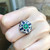Emerald with Blue Sapphire and Diamond Ring Set in 18 Karat White Gold Settings