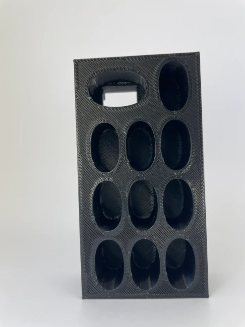 Top angle of the storage dock highlighting dedicated slots for a slim vape pen and multiple spare cartridges.