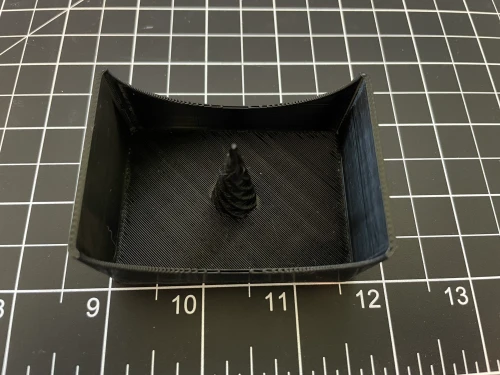 lose-up showing the debowler ashtray insert removed from its dedicated tray compartment for easy cleaning.