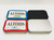 Kush Kitteh pocket organizers shown nested inside various colored tin options including Red, Blue, Plain Black, and Plain Silver.