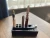 Profile angle highlighting the unique ergonomic incline layout designed to prevent vertical tip-overs and keep fluid at the base.