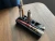 ush Kitteh 3D-printed angled desktop cartridge organizer stand holding 8 individual storage pieces cleanly.