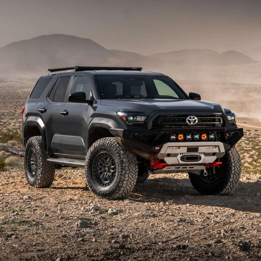 Old Man Emu MT64 Kit RR 0 in/0 lb 2137K, off-road vehicle suspension kit installed on a rugged SUV in desert terrain.