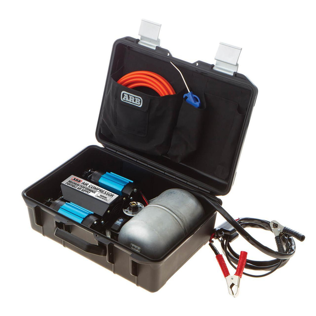 ARB Twin Motor Portable 12V Air Compressor CKMTP24, portable air compressor kit with a compact black hard shell carrying case, featuring a blue twin motor compressor, air hose, and accessories for vehicle inflation and emergency use.