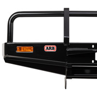 ARB Winch Bumper 3414060, black metal off-road bumper with integrated amber side marker light and ARB logo, designed for vehicle protection and winching attachment.