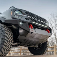 ARB Non-Winch Front Bumper 3280010B, close-up of a rugged black steel bumper with red recovery points and skid plate mounted on a Ford Bronco