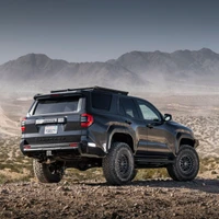 Old Man Emu MT64 Kit FR 3 in/0 lb, RR 0 in/0 lb 2132K, vehicle suspension kit on off-road rugged terrain with mountainous landscape in the background.
