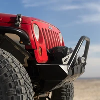 ARB Winch with Synthetic Rope, close-up view of the red Jeep vehicle's front with the winch mounted on the bumper, showcasing the black synthetic rope and protective bumper.