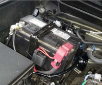 ARB Compressor Mounting Bracket for Toyota Tacoma (2024+), close-up view of the black mounting bracket installed on a vehicle's engine compartment.