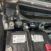 ARB Compressor Mounting Bracket for Toyota Tacoma 2024+, installed inside the engine bay near the battery and electrical components.