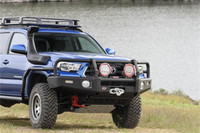 ARB Summit Bumper Kit 3423160KB, off-road truck front bumper with mounting points for lights and winch, rugged black metal design.