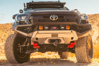 ARB Zenith Winch Bumper for Toyota Tacoma (2024+), front view of the rugged off-road truck bumper mounted on a Toyota Tacoma in a desert landscape.