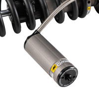 Old Man Emu BP-51 Coilover Strut Front Left BP5190036L, a high-performance suspension component featuring a durable coilover design with a metallic shock absorber and black spring coils.