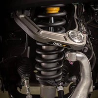 Old Man Emu MT64 Suspension Kit with FB UCA for Tacoma, front 3-inch/0 lb, rear 2-inch/0 lb, vehicle suspension system featuring coil springs and shock absorbers.