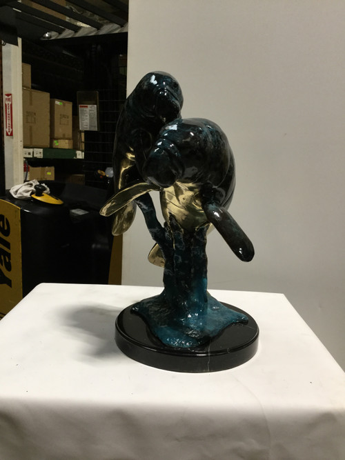 Two Manatees in Special Patina on Marble Base Room Scene