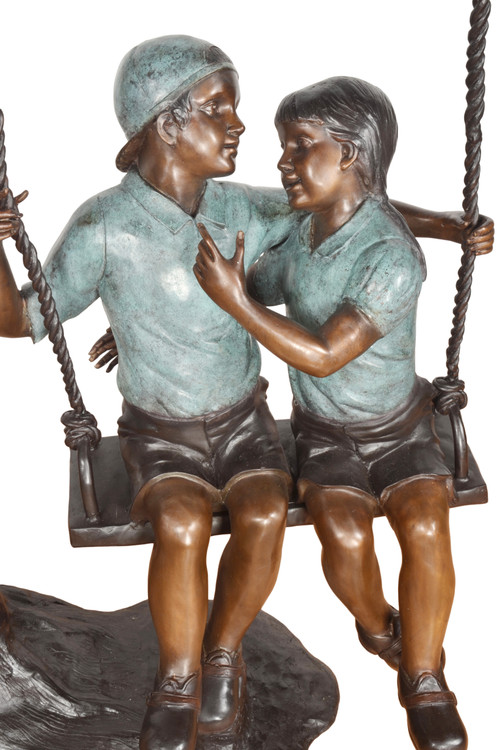 Boy and Girl on Swing Close Up Image