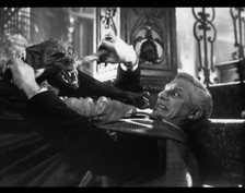 Fright Night's Peter Vincent fights for his life against Jerry Dandridge in his hideous bat form. 