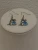 Silver-tone Dolphin Dangle Earring Feature a Blue Stone and Small Crystals