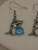 Silver-tone Dolphin Dangle Earring Feature a Blue Stone and Small Crystals