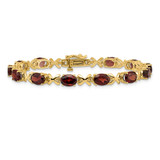 14k Complete 7x5mm Oval Garnet X-design 7 inch Bracelet