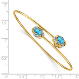 14k Polished Complete Oval Blue Topaz and .03 carat Diamond Flexible Bangle Bracelet