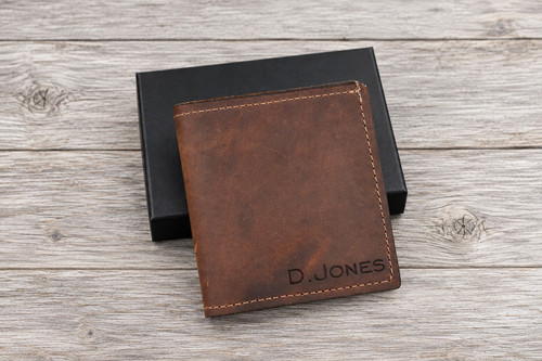 USA-made personalized leather bifold wallet crafted from genuine Copper Rough & Tough leather, featuring custom name engraving and a classic brown finish. A custom engraved men's wallet with a gift box, perfect for Christmas gifts for him, anniversary gifts for husbands, Valentine's Day gifts for boyfriends, Father's Day, birthdays, and graduation gifts.