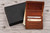 personalized men's leather bifold wallet crafted from genuine Copper Rough & Tough leather, featuring a clear ID window, card slots, and custom message engraving. Shown open with a personalized leather inscription and black gift box. A custom engraved wallet makes a great Christmas gift, Valentine's Day gift for husband or boyfriend, Father's Day gift for dad, anniversary gift, birthday gift, or graduation present.