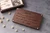 Close-up of optional custom message engraved under the lid of a small personalized walnut jewelry box.
 Copy