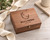Personalized walnut wooden keepsake box with custom engraved floral monogram, names, and wedding date. Elegant wooden memory chest for wedding gifts, anniversary presents, bridal showers, engagement gifts, and Christmas gifts for couples. Features natural walnut wood grain and antique bronze latch, perfect for storing wedding photos, love letters, treasured memories, and special occasion keepsakes.