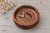 Personalized round walnut ring dish featuring custom engraved names, wedding date, and mountain design. Handcrafted from natural walnut wood, this engraved wooden ring tray holds wedding bands and engagement rings. A beautiful keepsake for wedding ceremonies, anniversaries, proposals, and personalized gifts for couples.