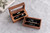 Personalized walnut wedding ring box with clear glass lid, shown open and closed on a light gray textured background. Features custom UV-printed names and wedding date, black velvet ring holders, and storage for 2–4 rings. Ideal for wedding ceremonies, ring bearers, and personalized wedding keepsakes.