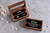 Two personalized walnut wedding ring boxes with clear glass lids, shown open and closed. Features a custom UV-printed mountain wedding design with names and date, black velvet ring slots, and wedding bands displayed inside. This quad wooden ring holder accommodates 2–4 rings and is ideal for mountain-themed weddings, ring bearers, and wedding ceremonies.