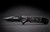 Custom engraved black folding pocket knife with textured handle and partially serrated blade. A personalized Father's Day gift for dad, birthday gift for father, or thoughtful Christmas gift from son or daughter.