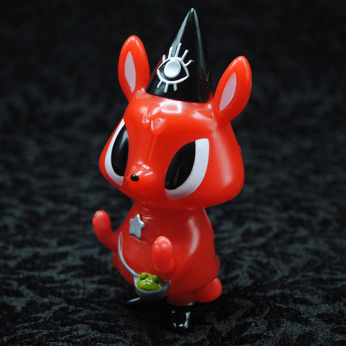 A red animal figurine wearing a black hat