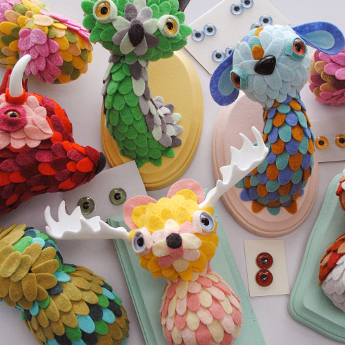 A variety of mounted animal head sculptures