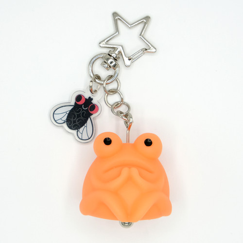Orange toad keychain with fly charm