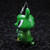 A  green animal figurine wearing a black hat