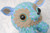 A round blue animal sculpture with many legs