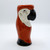 A red parrot shaped ceramic drinking glass