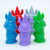 Multicolored figurines of animals wearing hats and capes