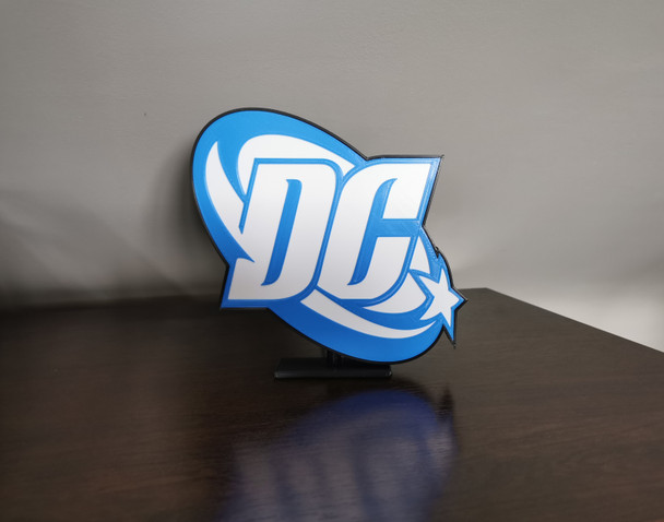 Discover the legacy of DC Comics, a pioneer in the comic book industry since 1934. Explore our LED illuminated logo, a tribute to iconic heroes and sustainability.