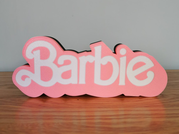 Embrace the magic of the Barbie Movie with this LED illuminated logo. A unique collectible for fans, made from biodegradable materials and powered by USB.