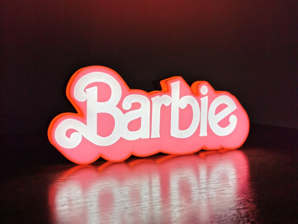 Calling all Barbie fans! Enhance your collection with this stunning LED illuminated Barbie Movie logo, a biodegradable masterpiece celebrating the beloved film.
