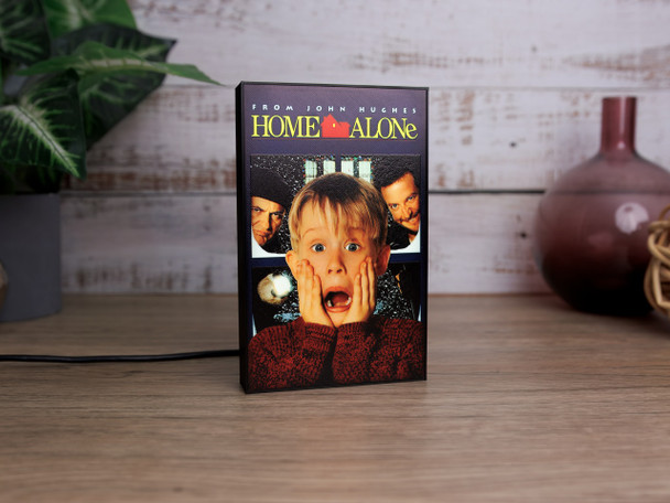 Close‑up of Home Alone USB light showing detailed artwork and soft warm glow.