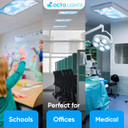 Teacher adjusting a cloud-themed light cover in a school classroom, demonstrating the product's practicality.